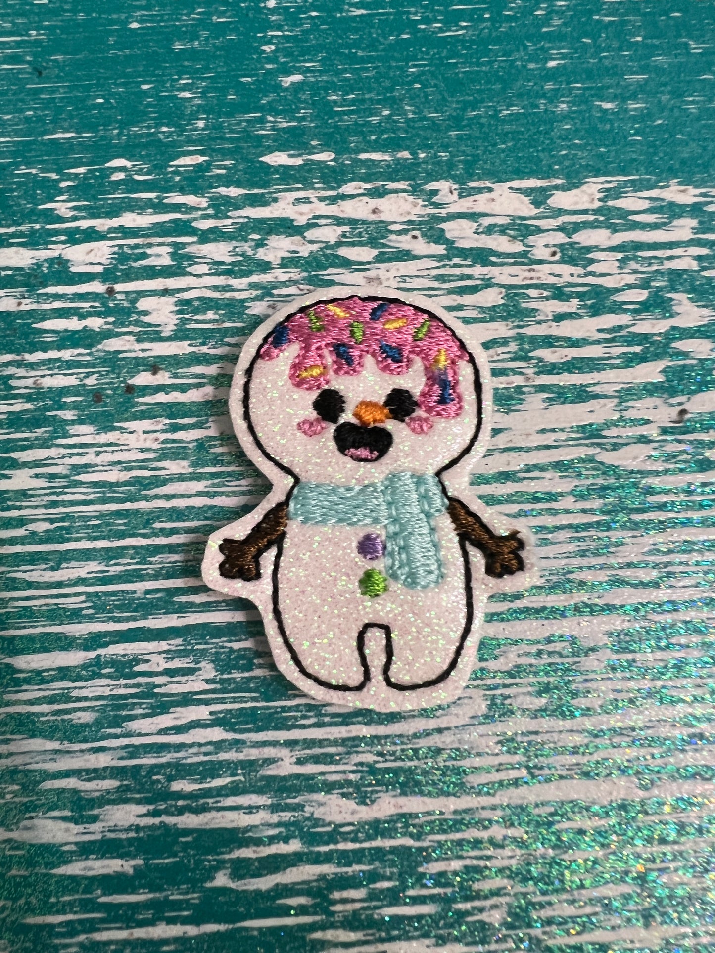 Sparkly snowman with frosting and sprinkles